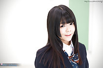 Shinjo Nozomi in uniform long hair falling over her shoulders