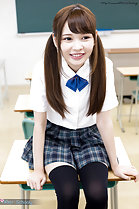 Atomi Shuri sitting on desk wearing uniform hair in pigtails wearing stockings