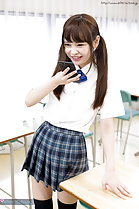 Student Atomi Shuri standing in classroom hair in pigtails wearing uniform