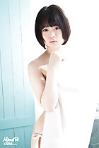 Minori standing behind curtain short hair